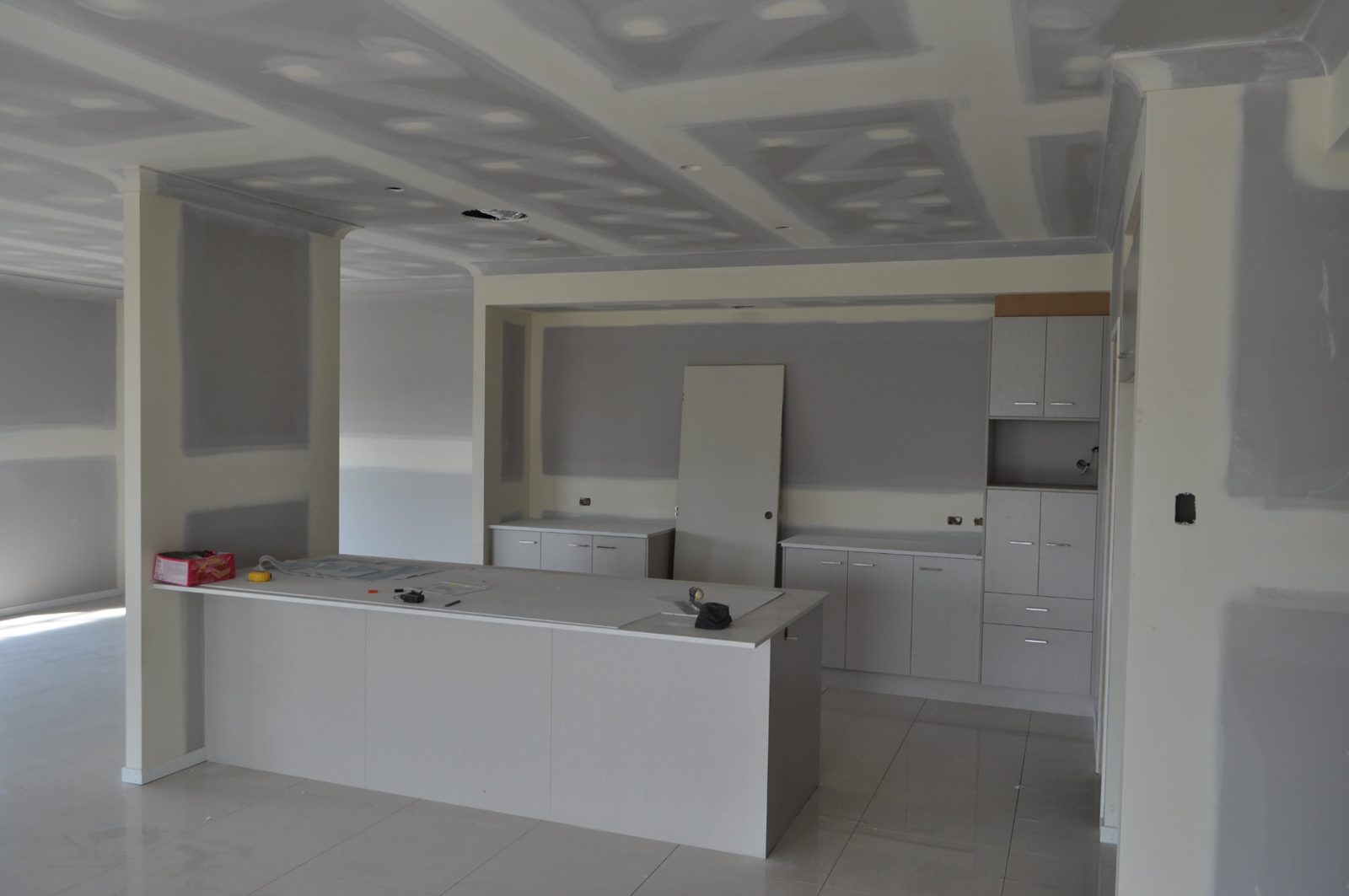 Kitchen and living area with plasterboard joints before finishing