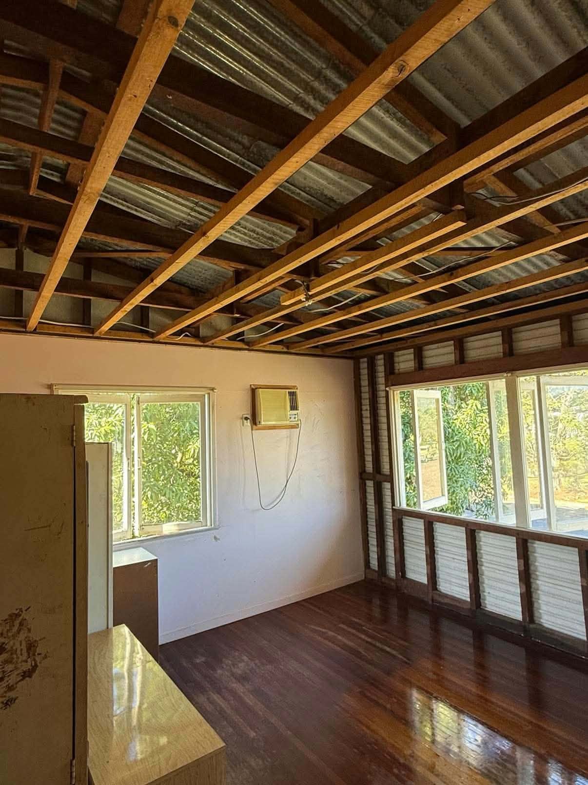 Furnished room stripped back to its wall and ceiling frame ready for new plastering